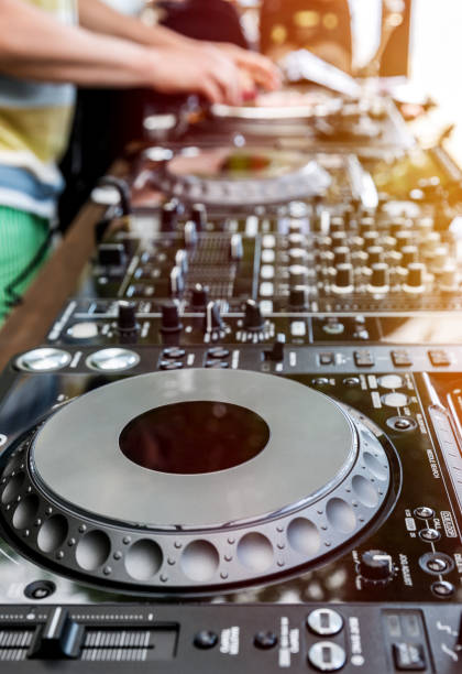 istock Dj mixes the track in club 649902406