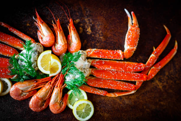istock Crab legs with lemon and shrimps 649911638