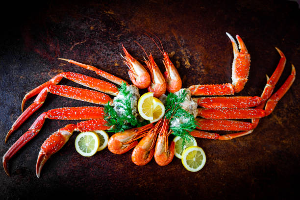 istock Crab legs with lemon and shrimps 649911658