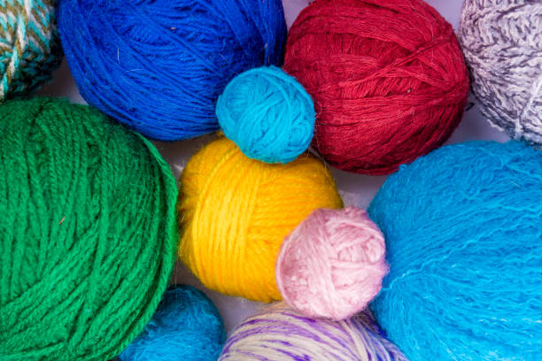 istock wool yarn ball. Colorful threads for needlework. Colorful fabric texture background 649911986