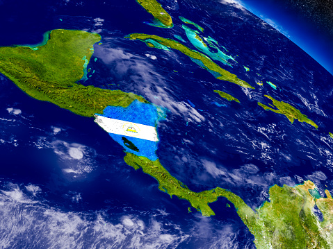 Flag of Nicaragua on planet surface from space. 3D illustration with highly detailed realistic planet surface and clouds in the atmosphere. 3D model of planet created and rendered in Cheetah3D software, 4 Mar 2017. Some layers of planet surface use textures furnished by NASA, Blue Marble collection: http://visibleearth.nasa.gov/view_cat.php?categoryID=1484