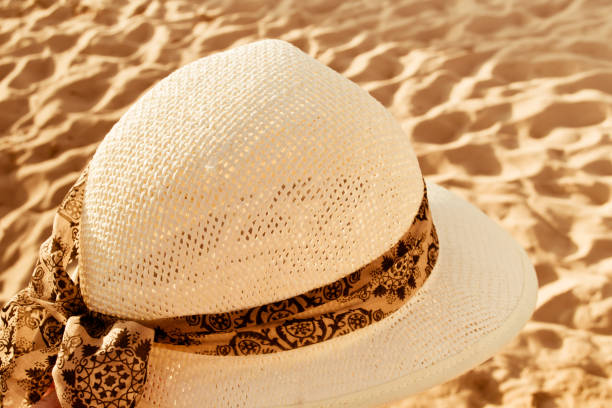 istock Women's hat on the beach. Ocean, Chipiona. 649926162