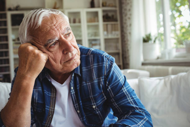 istock Worried senior man sitting on a sofa 649932032
