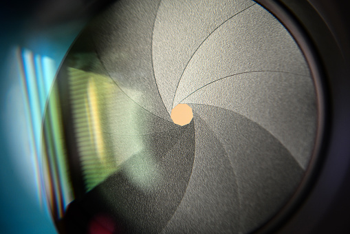 The diaphragm of a camera lens aperture - Selective focus with shallow depth of field - Color toned image