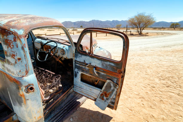 A rusty, abandoned, vintage American truck in the desert, Namibia.