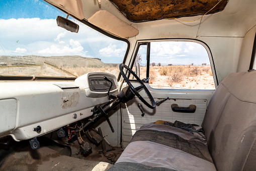Interior of an abandoned, vintage American truck in the desert, Namibia.