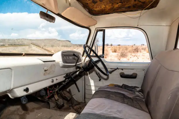 Photo of Interior of abandoned truck in the desert