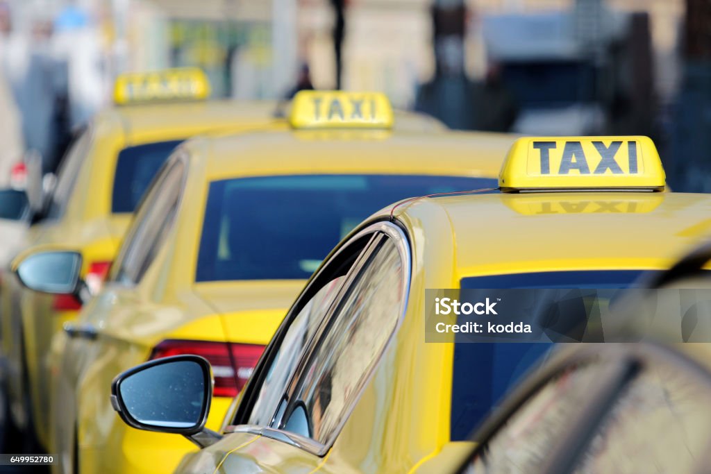 detail of yellow taxi cars on the street Taxi Stock Photo