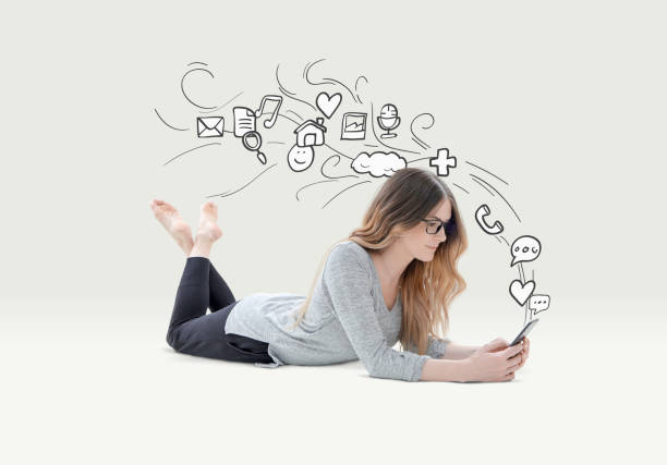 istock Woman relaxed using phone with icons 649960798