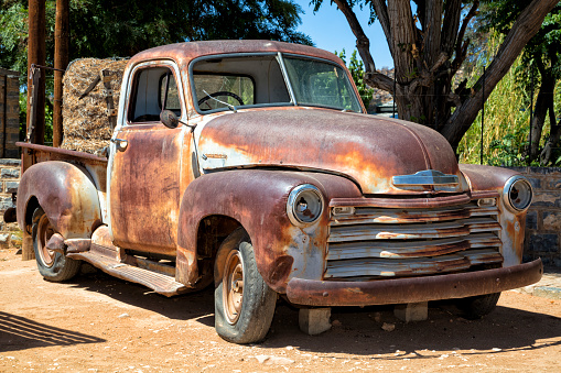 A rusty, abandoned, vintage American truck in Namibia.