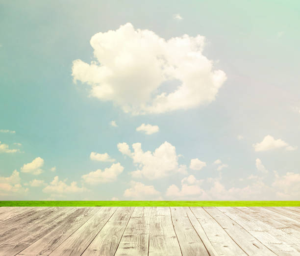 istock Background with empty wooden table over beautiful meadow 649970634
