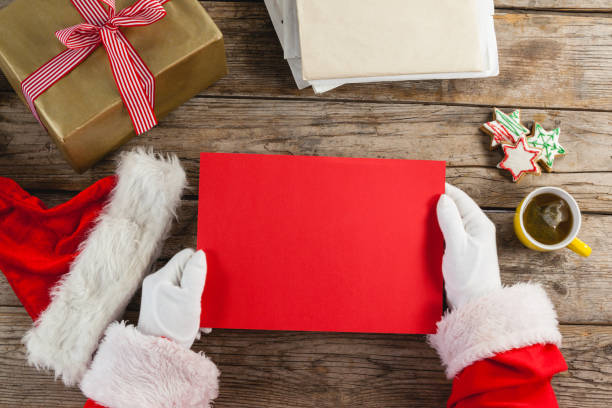 istock Santa claus holding a red placard 649987408