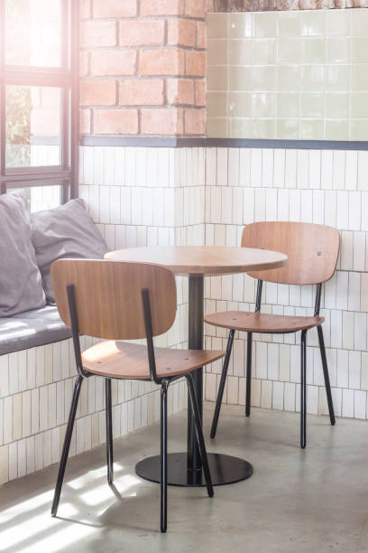 istock wooden chairs and table next to the glass window 650000530