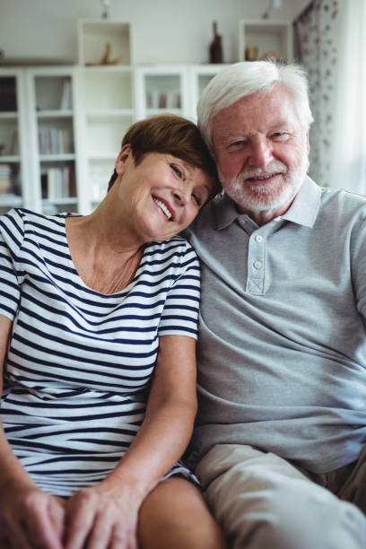 istock Senior couple sitting on sofa 650006514