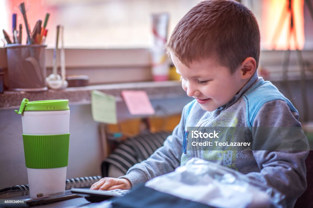 Boy Using Calculator Child Boy Using Calculator Stock Photo - Download Image Now ...