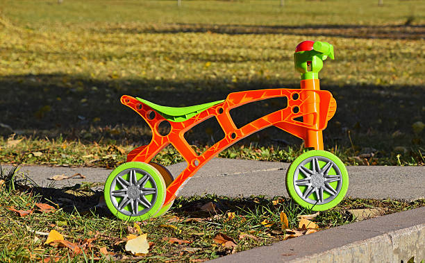 istock Tricycle On Grassy Field 650031563