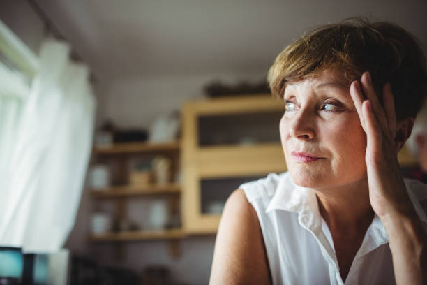 istock Worried senior woman with hand on forehead 650049276
