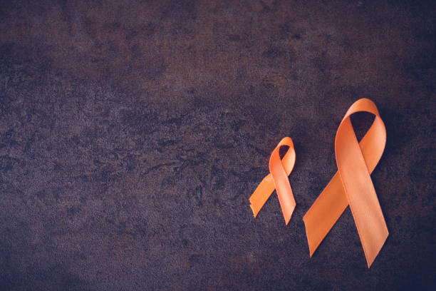 istock Orange Ribbons on toning background, Leukemia awareness, Self Injury Awareness Day, Multiple sclerosis awareness, Kidney cancer awareness 650056256