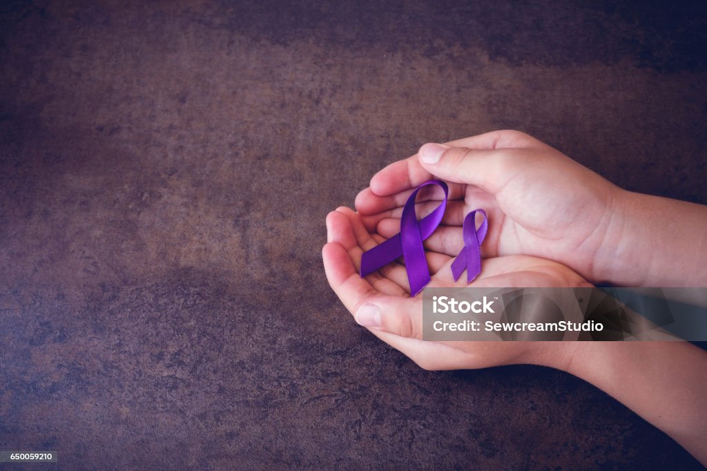 hands holding Purple ribbons,toning copy space background, Alzheimer's disease, Pancreatic cancer, Epilepsy awareness, Hodgkin's Lymphoma awareness Ribbon - Sewing Item Stock Photo