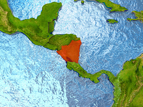 Top-down view of Nicaragua highlighted in red with surrounding region. 3D illustration with highly detailed realistic planet surface. 3D model of planet created and rendered in Cheetah3D software, 4 Mar 2017. Some layers of planet surface use textures furnished by NASA, Blue Marble collection: http://visibleearth.nasa.gov/view_cat.php?categoryID=1484