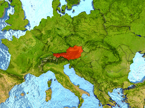 Top-down view of Austria highlighted in red with surrounding region. 3D illustration with highly detailed realistic planet surface. 3D model of planet created and rendered in Cheetah3D software, 4 Mar 2017. Some layers of planet surface use textures furnished by NASA, Blue Marble collection: http://visibleearth.nasa.gov/view_cat.php?categoryID=1484
