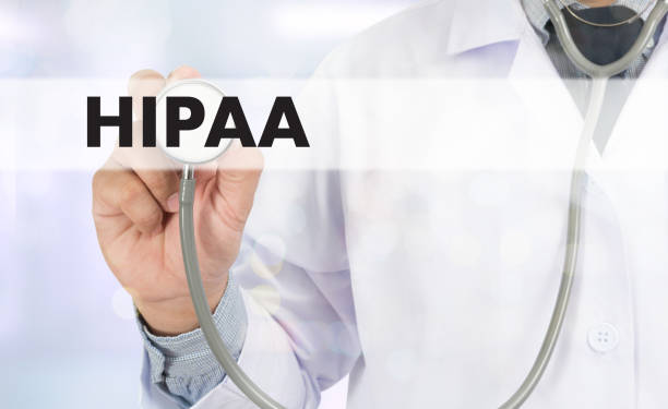 istock HIPAA Professional doctor use computer and medical equipment all around, desktop top view 650097548