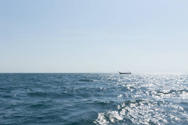 istock Ocean water background, clean and clear blue emerald sea view from boat. 650117356