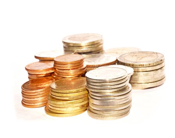 istock Many stacks of coins in various sizes and valued on white background 650128854