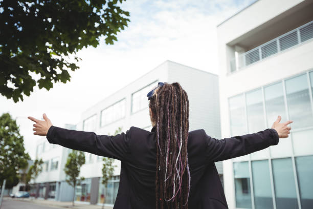 istock Businesswoman standing with arms outstretched 650130084