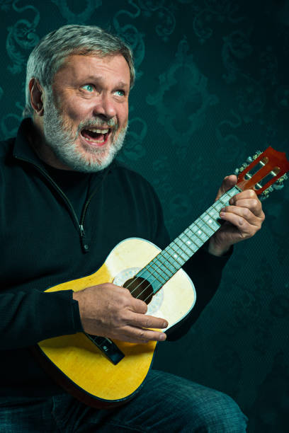 istock Studio portrait of senior man with guitar 650136826