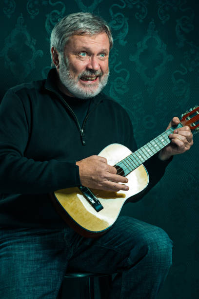 istock Studio portrait of senior man with guitar 650137084