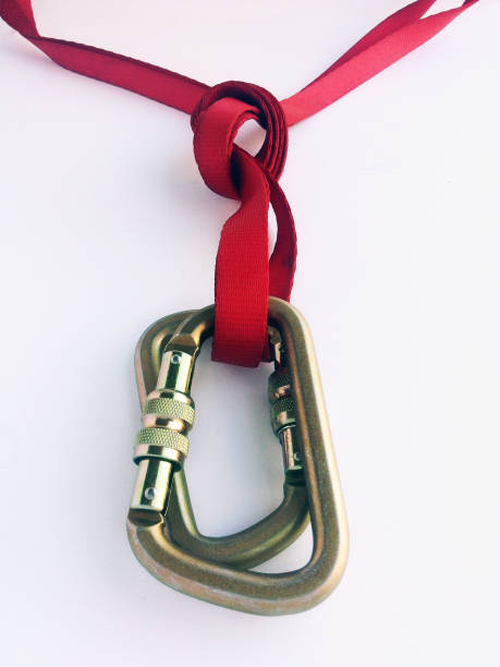 istock anchoring an abseil or rappel and equalising with an overhand 650141390
