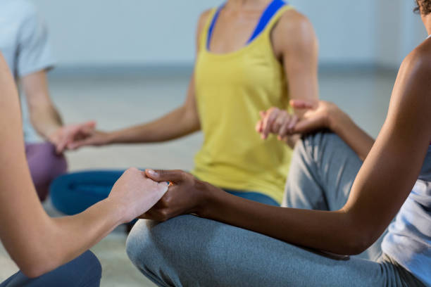 istock Group of people performing yoga 650142136