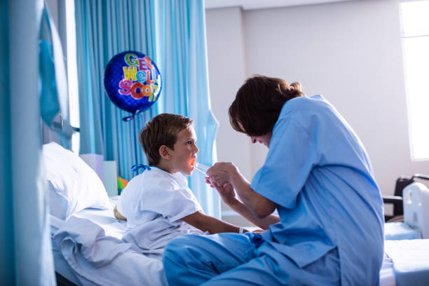 istock Female doctor examining patient mouth 650146078