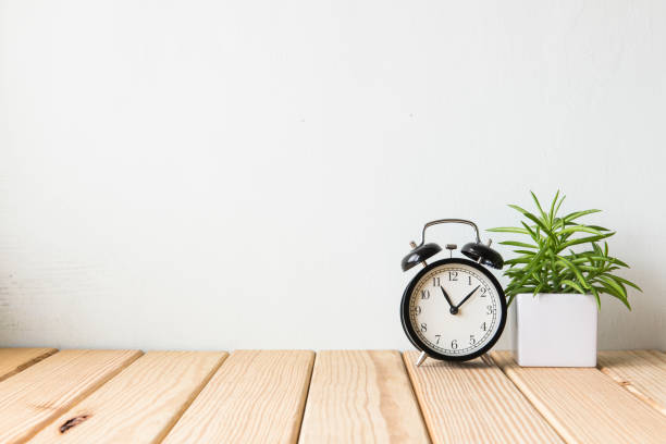 istock Interior decoration clock with wooden flooring plant 650151472
