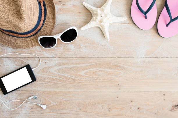 istock Straw hat and sunglasses on wood 650151646