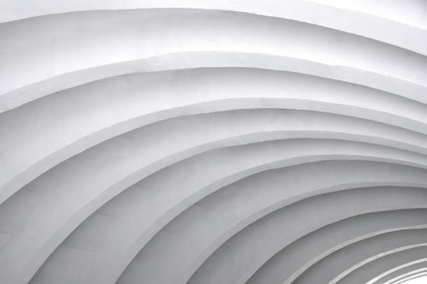 istock Architectural background. Modern white concrete arched ceiling of city bridge in perspective. 650159510
