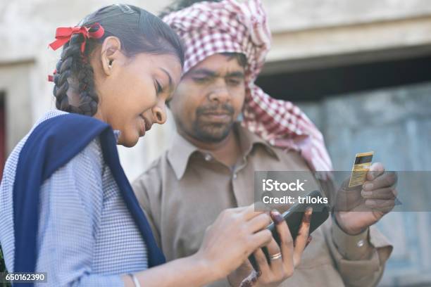 Father With Daughter Shopping Online Using Credit Card Stock Photo - Download Image Now