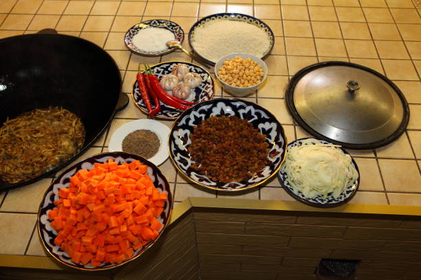 istock Preparation of pilaf with meat in a large bowl 650163094
