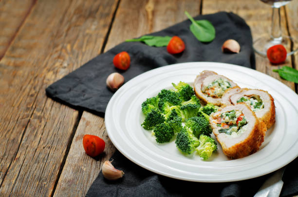 istock Ricotta tomato spinach stuffed turkey with broccoli 650163790