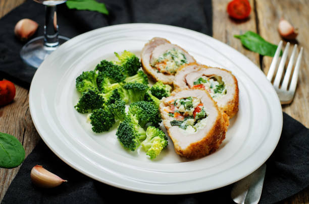istock Ricotta tomato spinach stuffed turkey with broccoli 650163834