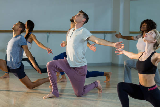 istock Group of people performing stretching exercise 650164130