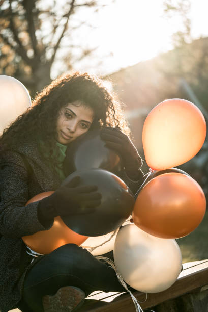 istock Multi raced girl with helium balloons 650168812