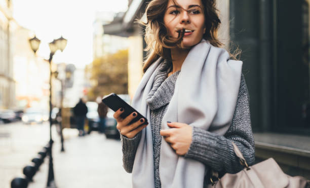 istock Woman texting outdoors 650169188