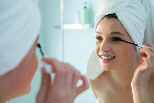 istock Woman applying mascara on eyelashes in bathroom 650175226
