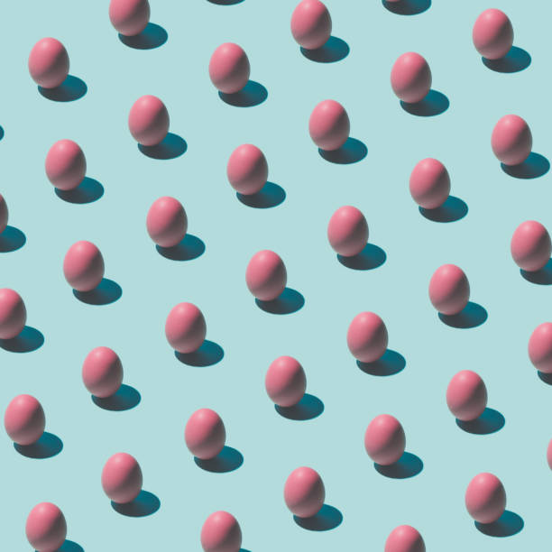 istock Pattern made of pink eggs on pastel blue background. Minimal food concept. 650176252