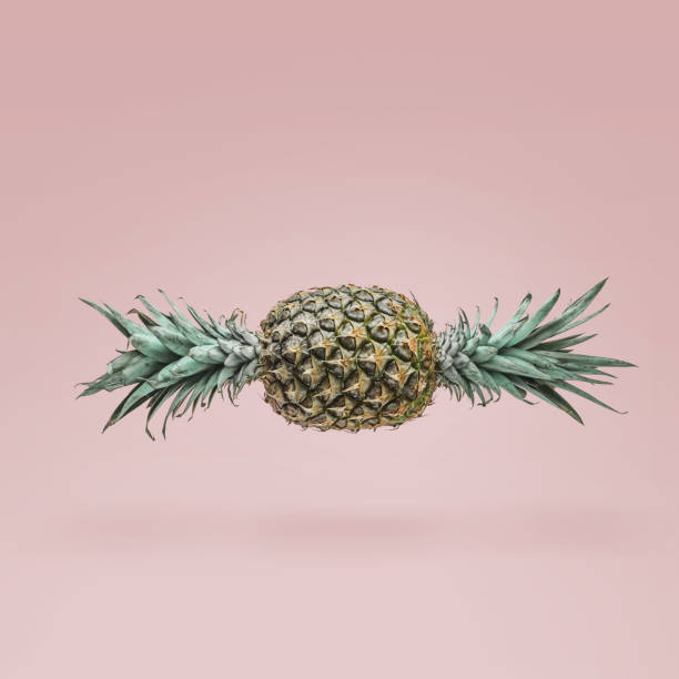 istock Candy made of ripe pineapple on pink background. Minimal candy concept. 650176786