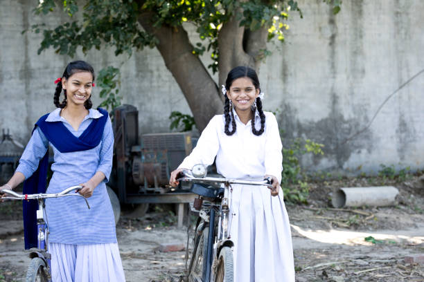 istock Indian girls with bicycle 650182166