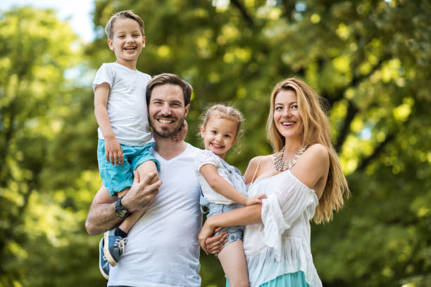istock Young happy parents with their children in nature. 650182544