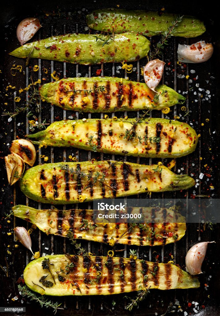 Grilled zucchini, top view Grilled zucchini with addition of thyme, lemon zest and garlic Grilled Stock Photo